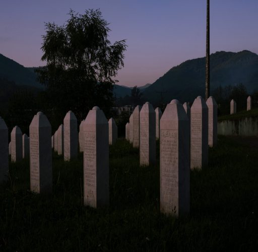 POTOCARI, BOSNIA AND HERZEGOVINA | MAY 2025 

“We Pray to Almighty God, May grievance become hope! May revenge become justice! May mothers’ tears become prayers. That Srebrenica never happen again. To no-one and nowhere!” Written as a prayer from Srebrenica, words of resilience by poet Raisu-I-Ulama inscribed at the entrance of the Potočari Genocide Memorial convey the need to remember.
Interned in a sloping field overlooking the former battery factory that served as the headquarters of the Dutch UN peacekeeping forces, row upon row of simple white gravestones mark the remains of more than 8,300 largely Muslim victims. Culminating on the 11th of July 1995, the genocidal massacre in what had been declared a “safe area”, is the largest mass killing in Europe since the second world war.