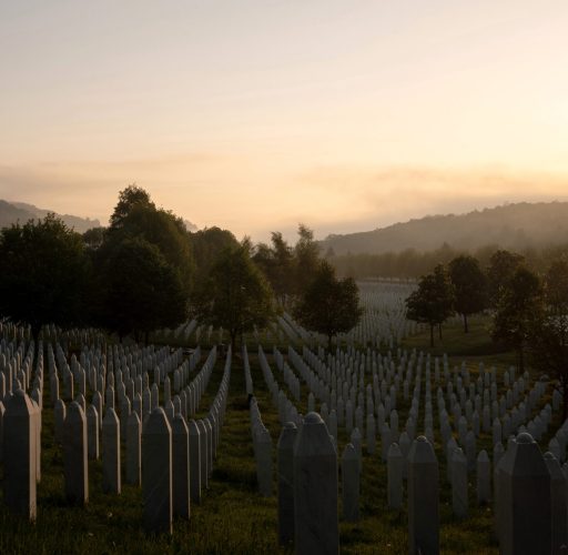 POTOCARI, BOSNIA AND HERZEGOVINA | MAY 2025 

“We Pray to Almighty God, May grievance become hope! May revenge become justice! May mothers’ tears become prayers. That Srebrenica never happen again. To no-one and nowhere!” Written as a prayer from Srebrenica, words of resilience by poet Raisu-I-Ulama inscribed at the entrance of the Potočari Genocide Memorial convey the need to remember.
Interned in a sloping field overlooking the former battery factory that served as the headquarters of the Dutch UN peacekeeping forces, row upon row of simple white gravestones mark the remains of more than 8,300 largely Muslim victims. Culminating on the 11th of July 1995, the genocidal massacre in what had been declared a “safe area”, is the largest mass killing in Europe since the second world war.